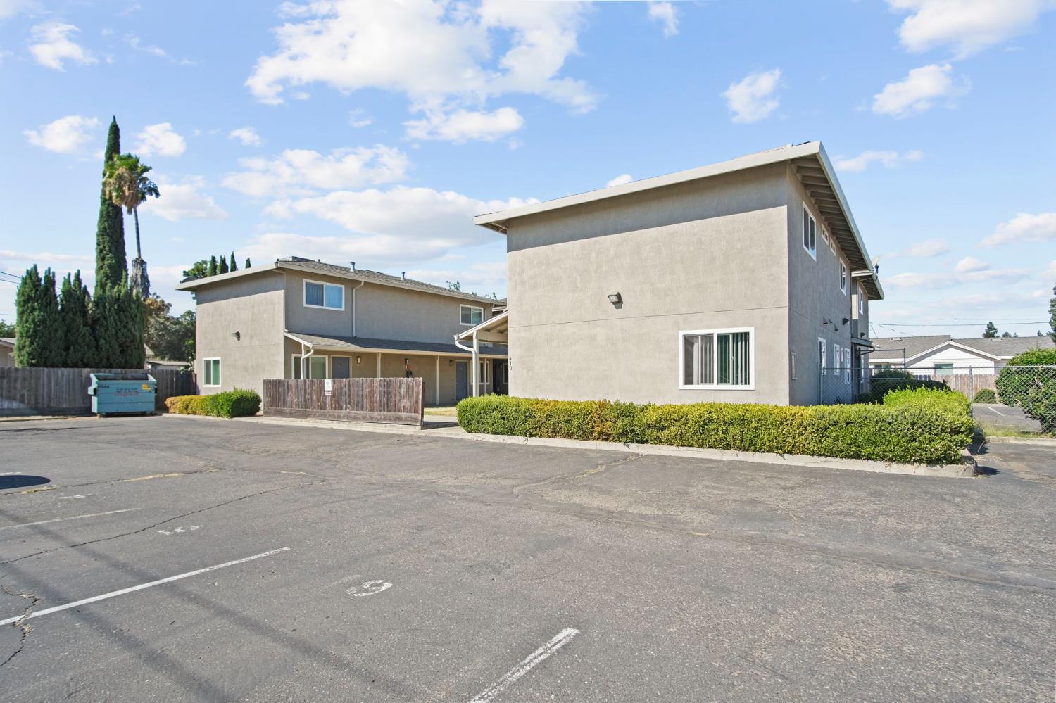 410 Pine Street Ripon, CA 95366 - Photo 4 of 16 a front view of a house with a yard and garage