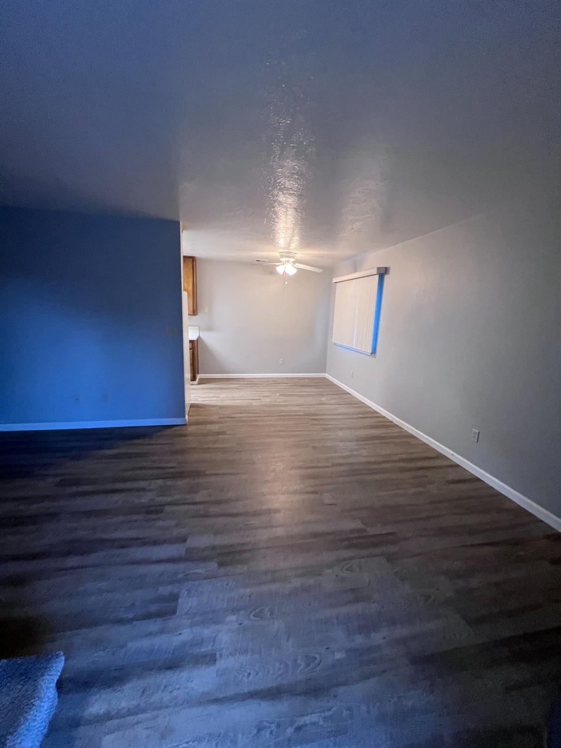 410 Pine Street Ripon, CA 95366 - Photo 6 of 16 a view of an empty room and wooden floor