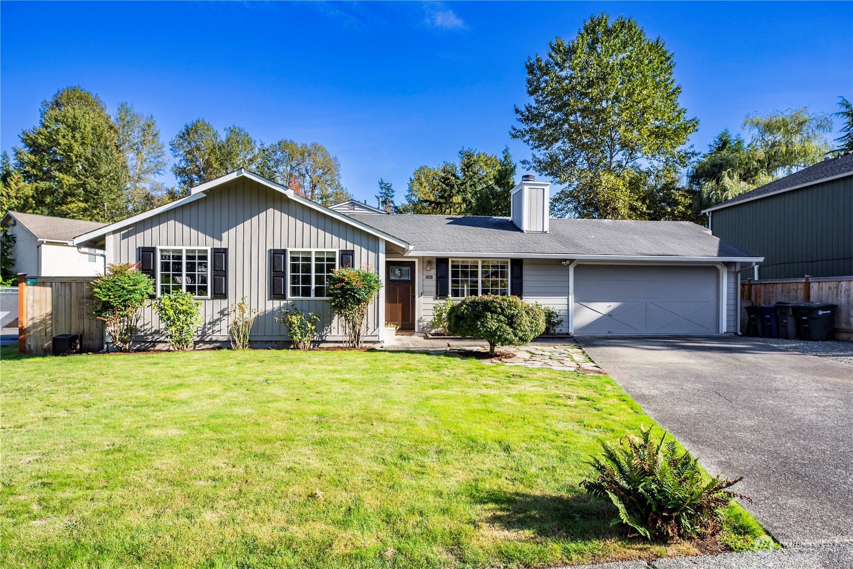 1826 225th Street Southeast Bothell, WA 98021 - Photo 1 of 33 a front view of a house with a yard