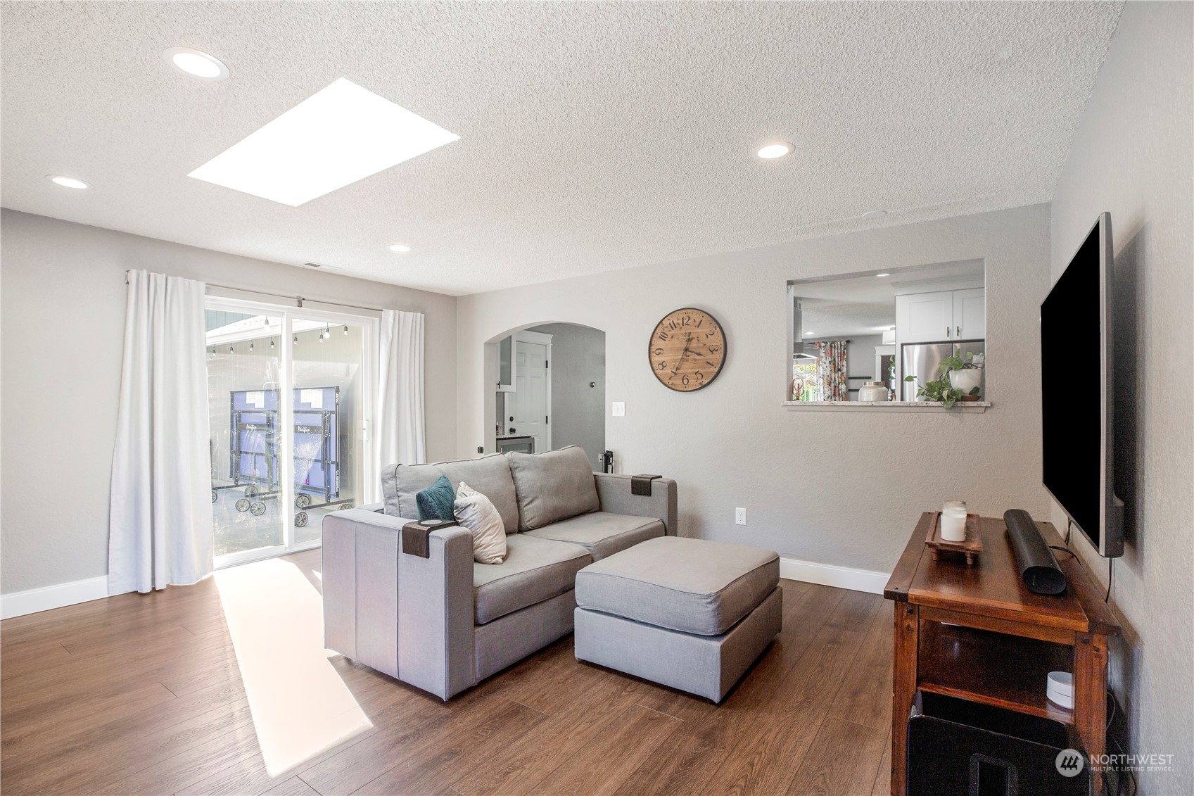 1826 225th Street Southeast Bothell, WA 98021 - Photo 12 of 33 a living room with furniture flat screen tv and wooden floor