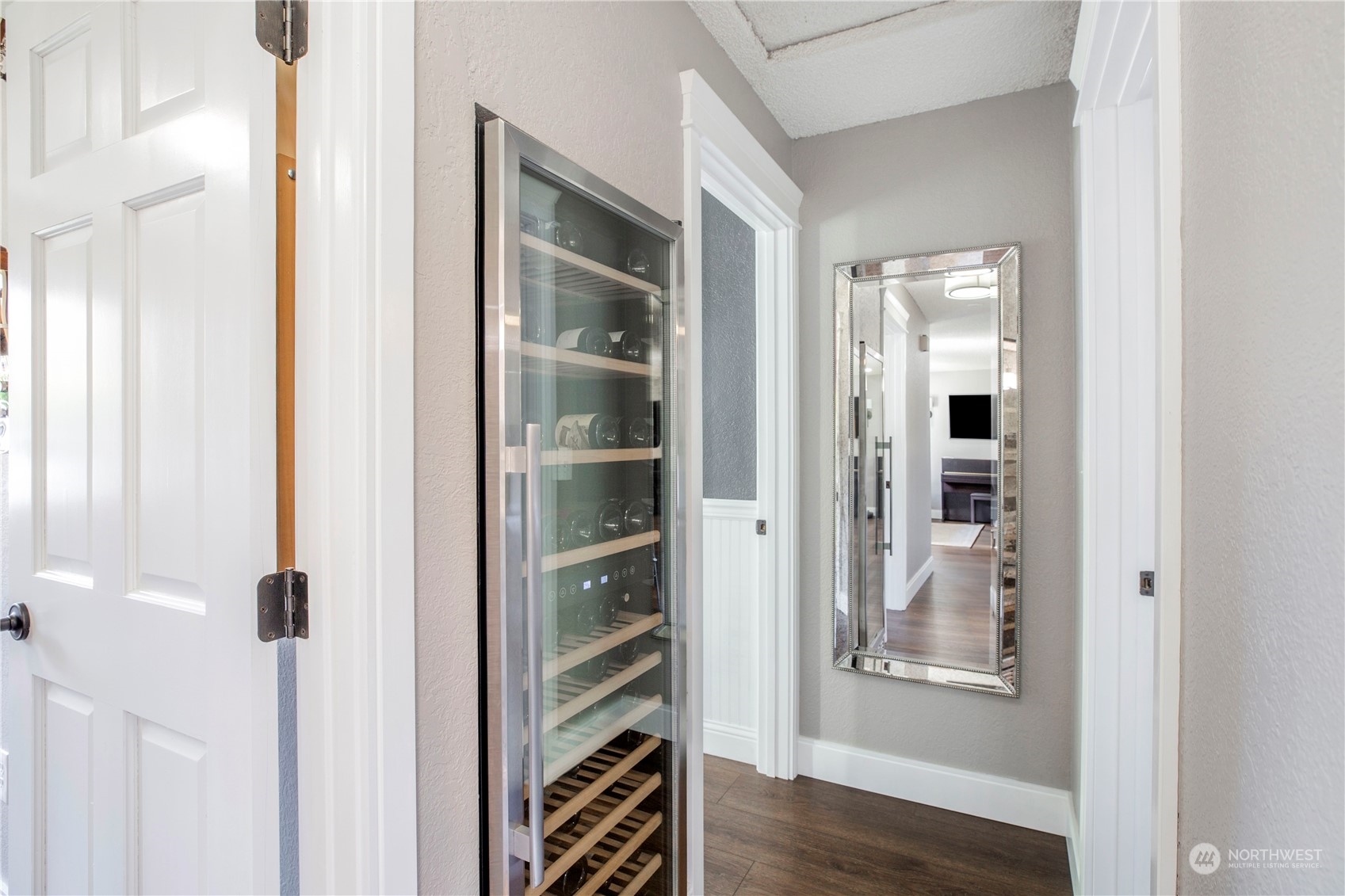 1826 225th Street Southeast Bothell, WA 98021 - Photo 13 of 33 a view of a hallway with wooden floor and closet
