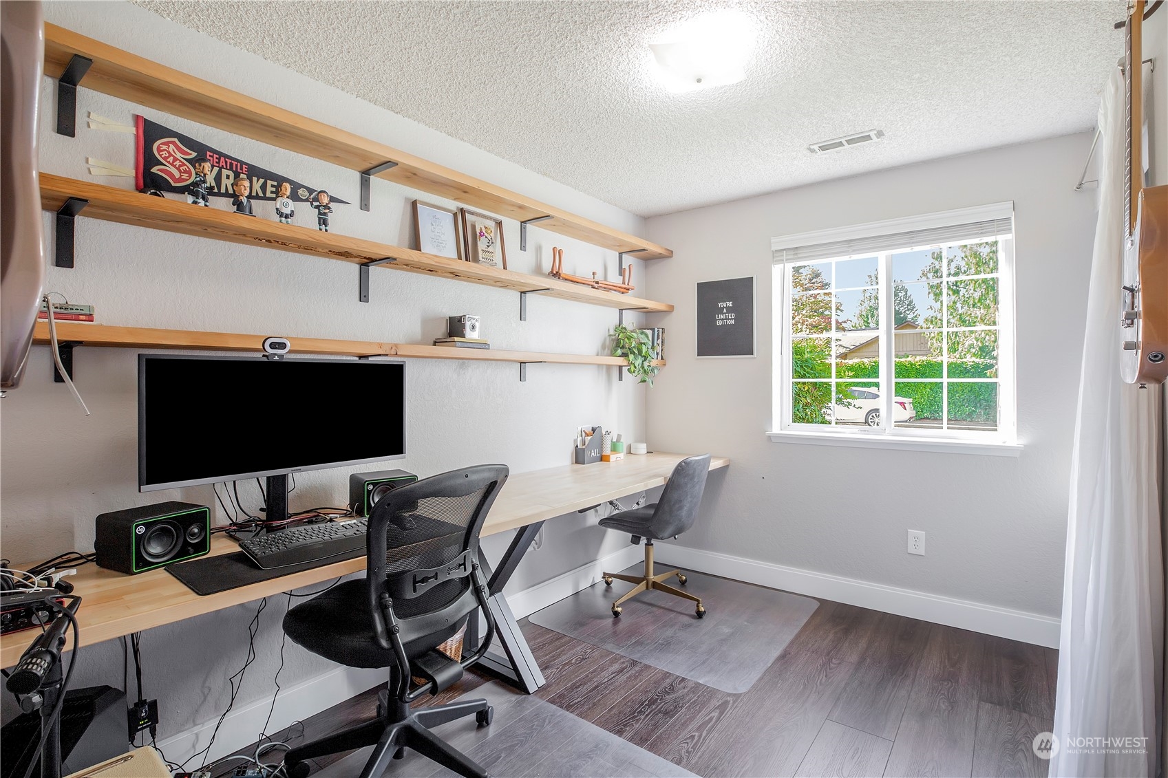 1826 225th Street Southeast Bothell, WA 98021 - Photo 15 of 33 a view of a workspace with furniture and a window