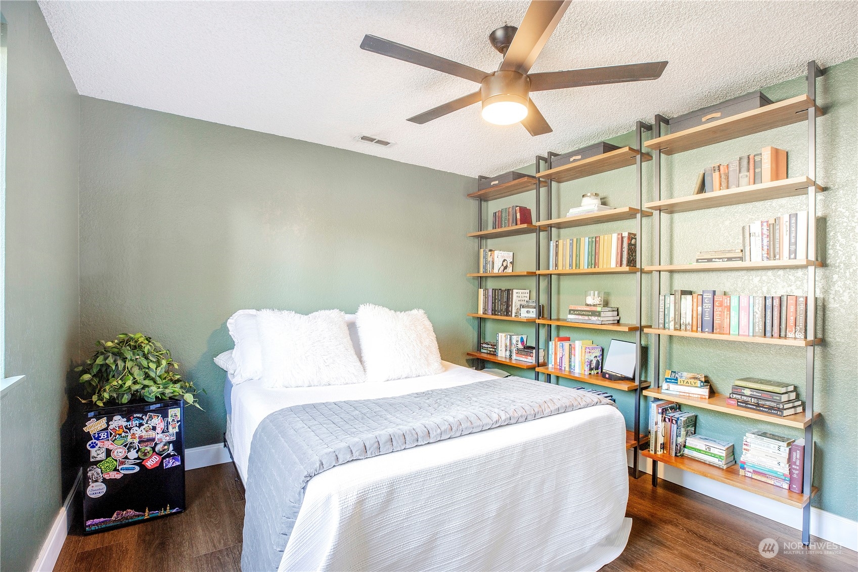 1826 225th Street Southeast Bothell, WA 98021 - Photo 17 of 33 a bedroom with a bed furniture and a book shelf