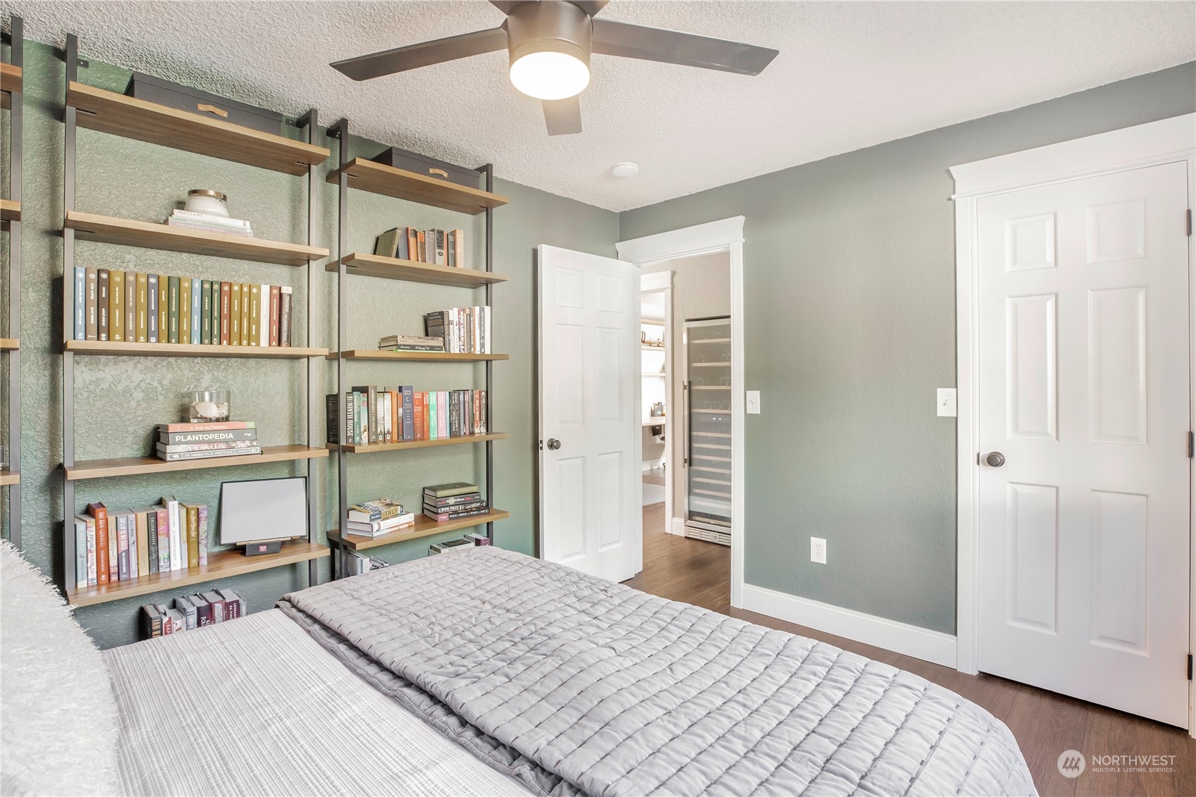 1826 225th Street Southeast Bothell, WA 98021 - Photo 18 of 33 a bedroom with a bed and a book shelf