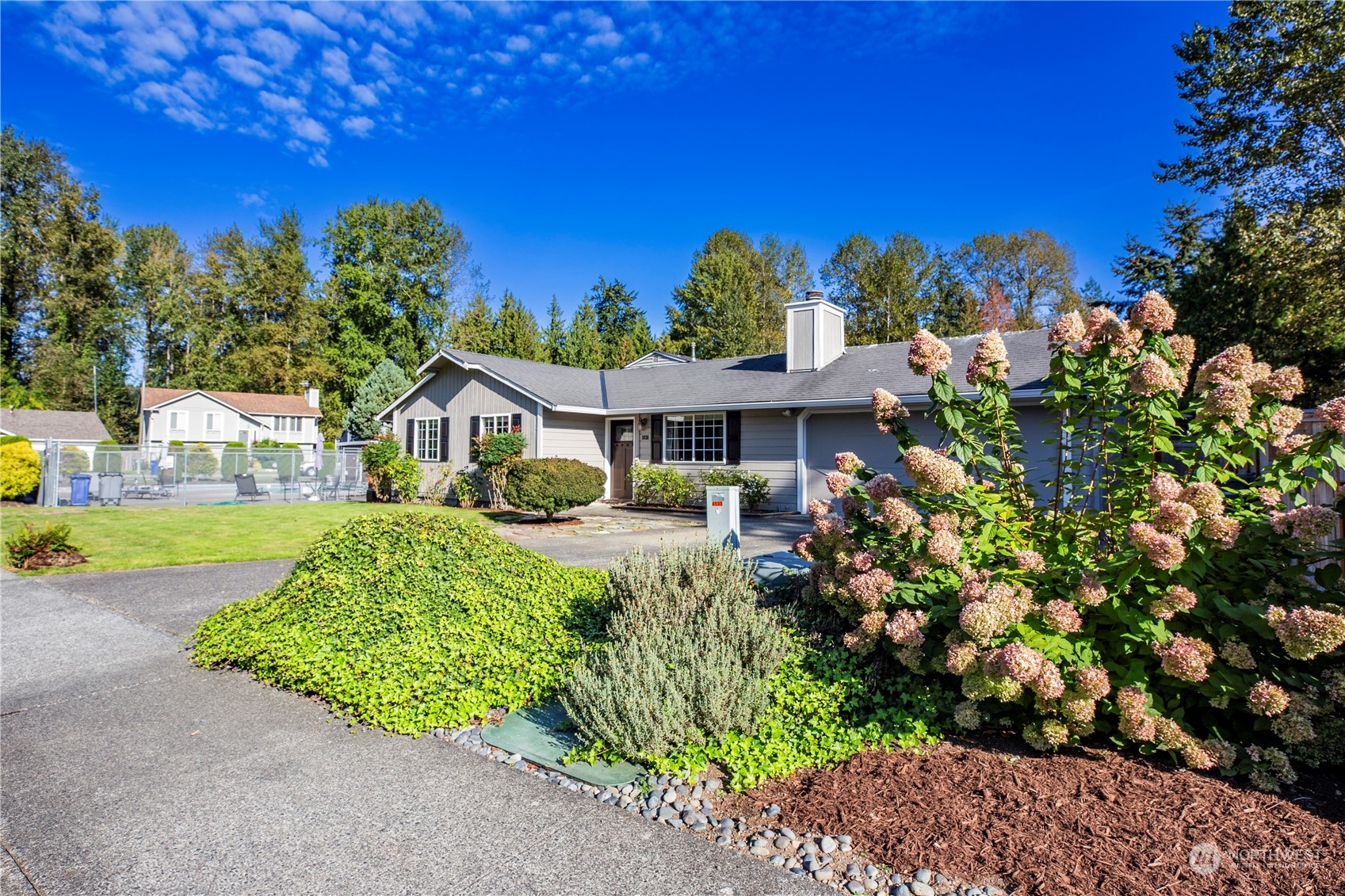 1826 225th Street Southeast Bothell, WA 98021 - Photo 2 of 33 a front view of a house with a yard