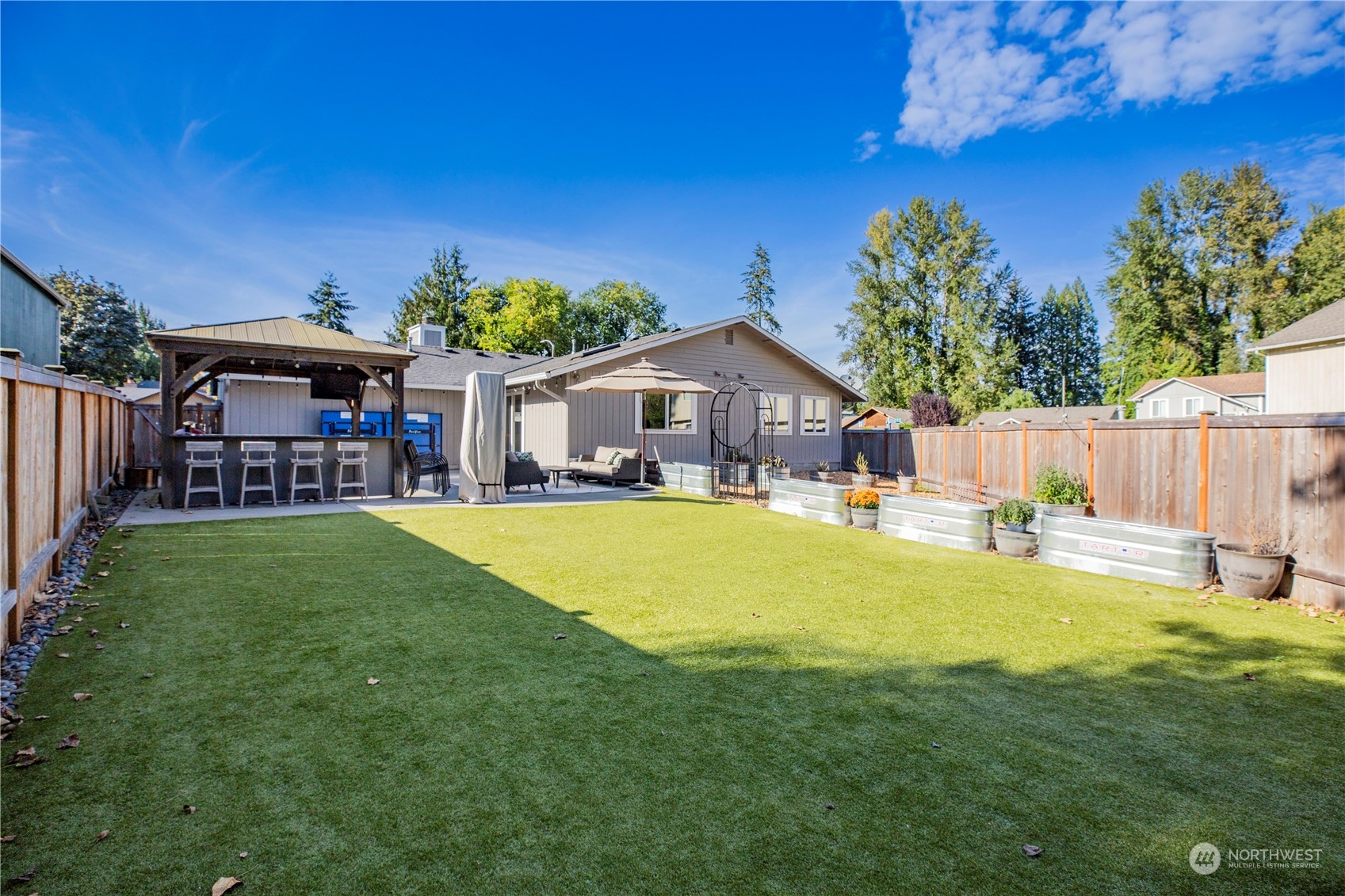 1826 225th Street Southeast Bothell, WA 98021 - Photo 31 of 33 a swimming pool view with a seating space and a yard