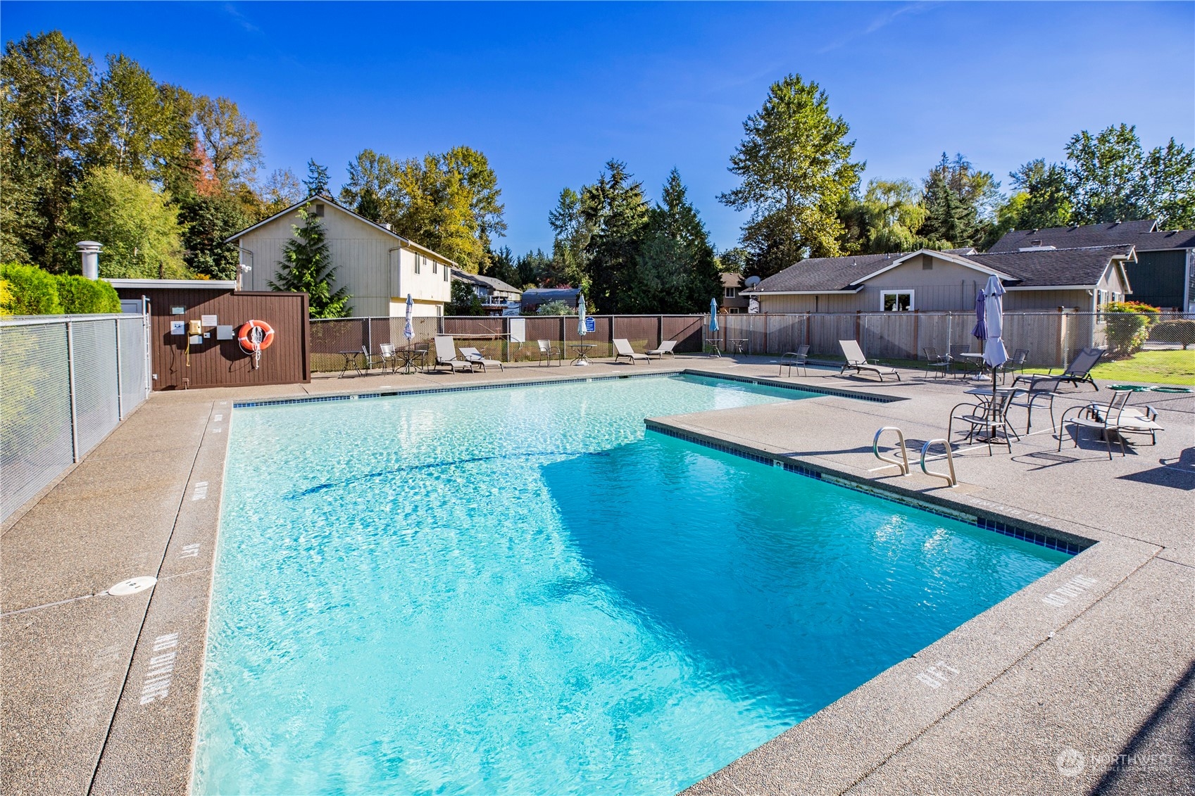 1826 225th Street Southeast Bothell, WA 98021 - Photo 33 of 33 a view of a swimming pool with a lounge chairs