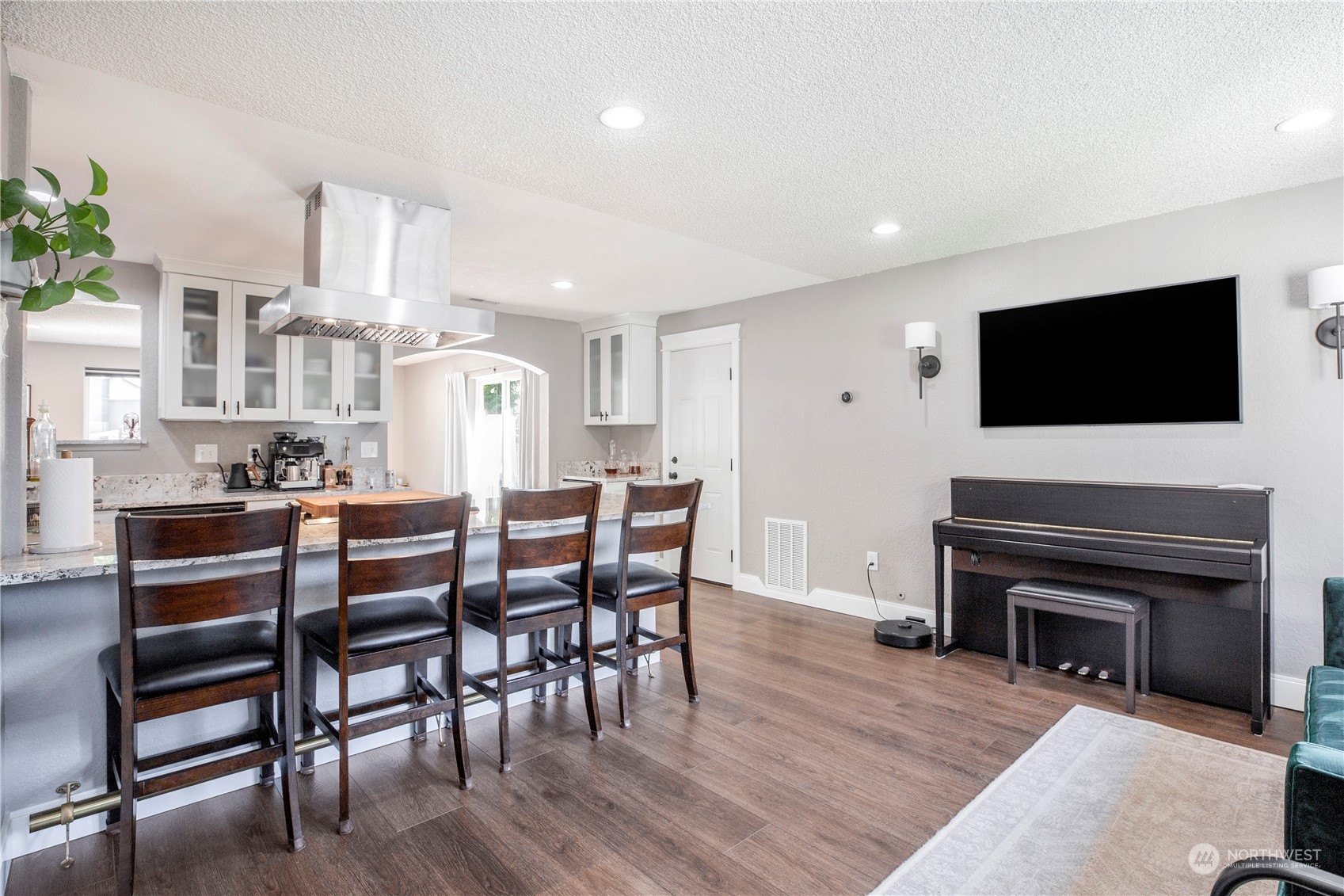 1826 225th Street Southeast Bothell, WA 98021 - Photo 5 of 33 a living room with furniture a flat screen tv and a fireplace