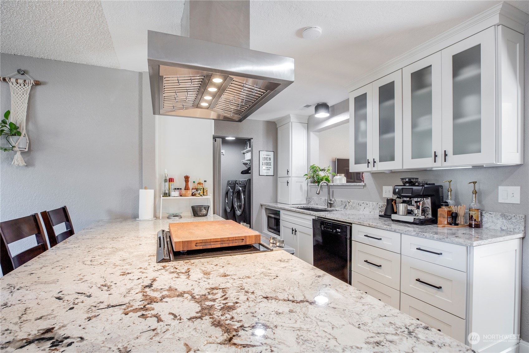 1826 225th Street Southeast Bothell, WA 98021 - Photo 7 of 33 a large bedroom with a bed and a view of kitchen