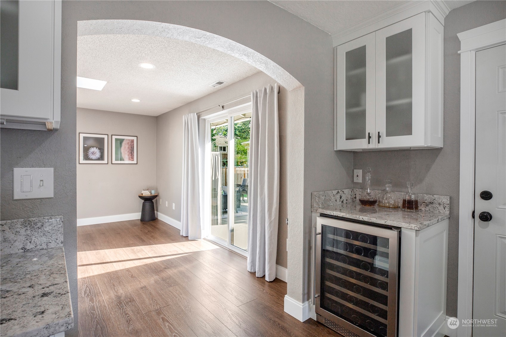 1826 225th Street Southeast Bothell, WA 98021 - Photo 8 of 33 a view of a kitchen with wooden floor and cabinets
