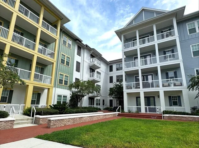 a front view of a building with a yard