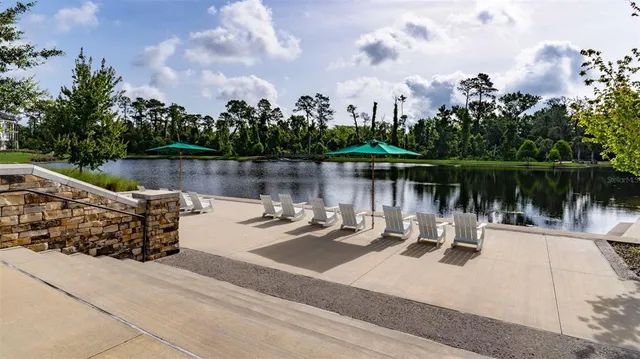 a view of a lake with a bench next to a lake