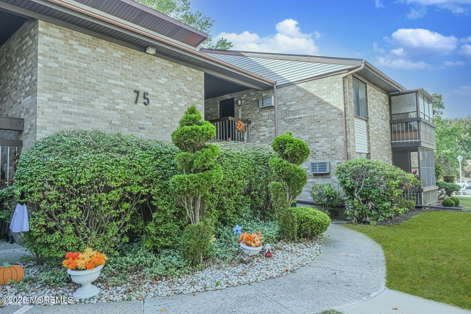 75 Overlook Way, Unit K Manalapan, NJ 07726 - Photo 1 of 24 a front view of a house with a yard