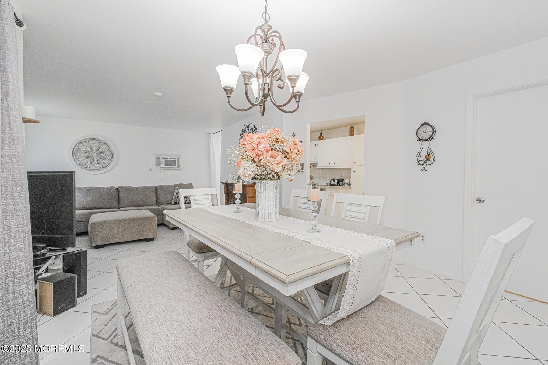 75 Overlook Way, Unit K Manalapan, NJ 07726 - Photo 11 of 24 a living room with furniture and a chandelier