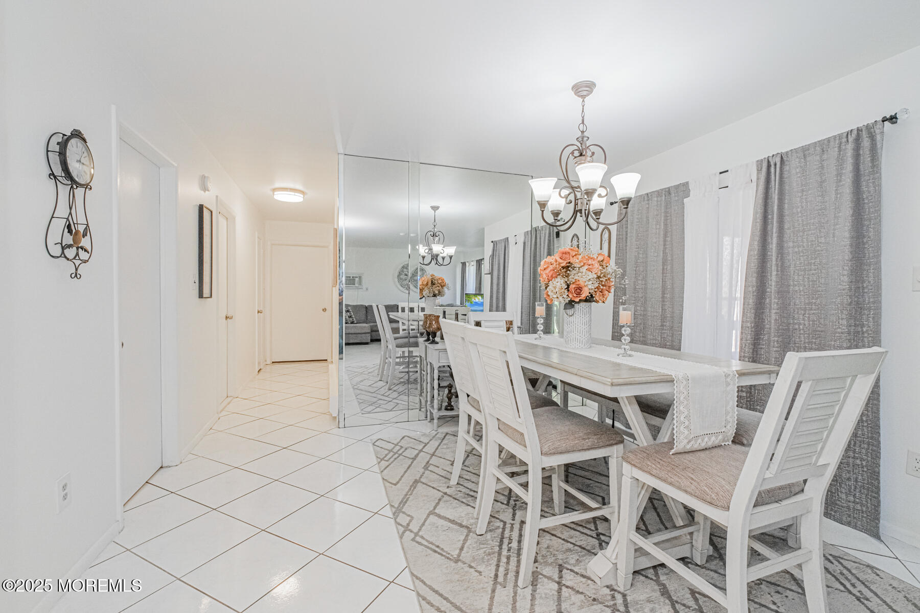 75 Overlook Way, Unit K Manalapan, NJ 07726 - Photo 13 of 24 a view of a dining room with furniture and chandelier