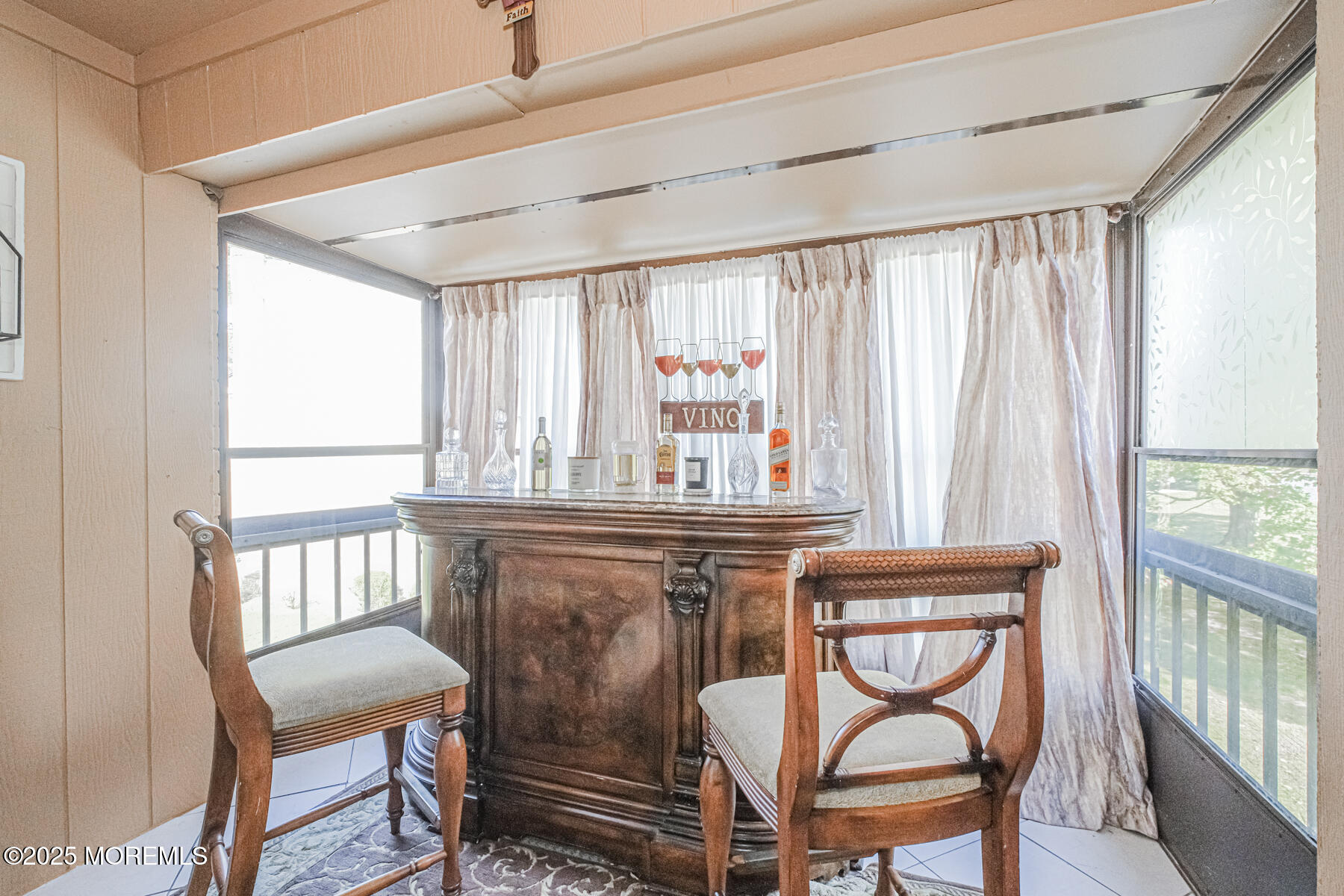 75 Overlook Way, Unit K Manalapan, NJ 07726 - Photo 14 of 24 a view of a dining room with furniture window and outside view