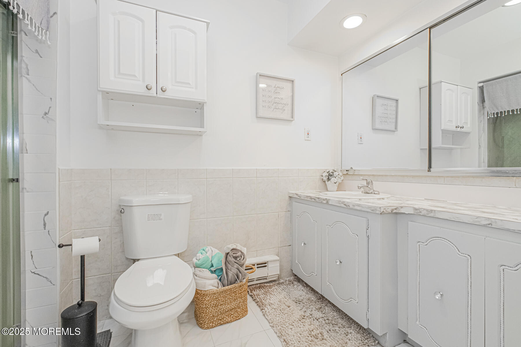 75 Overlook Way, Unit K Manalapan, NJ 07726 - Photo 17 of 24 a bathroom with a granite countertop toilet and a sink