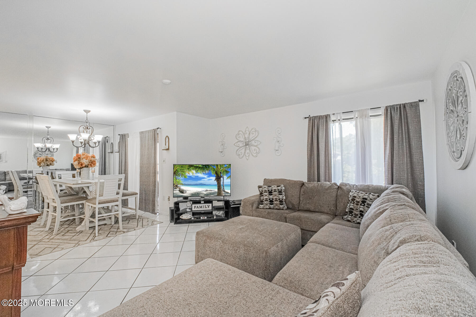 75 Overlook Way, Unit K Manalapan, NJ 07726 - Photo 4 of 24 a living room with furniture and a flat screen tv