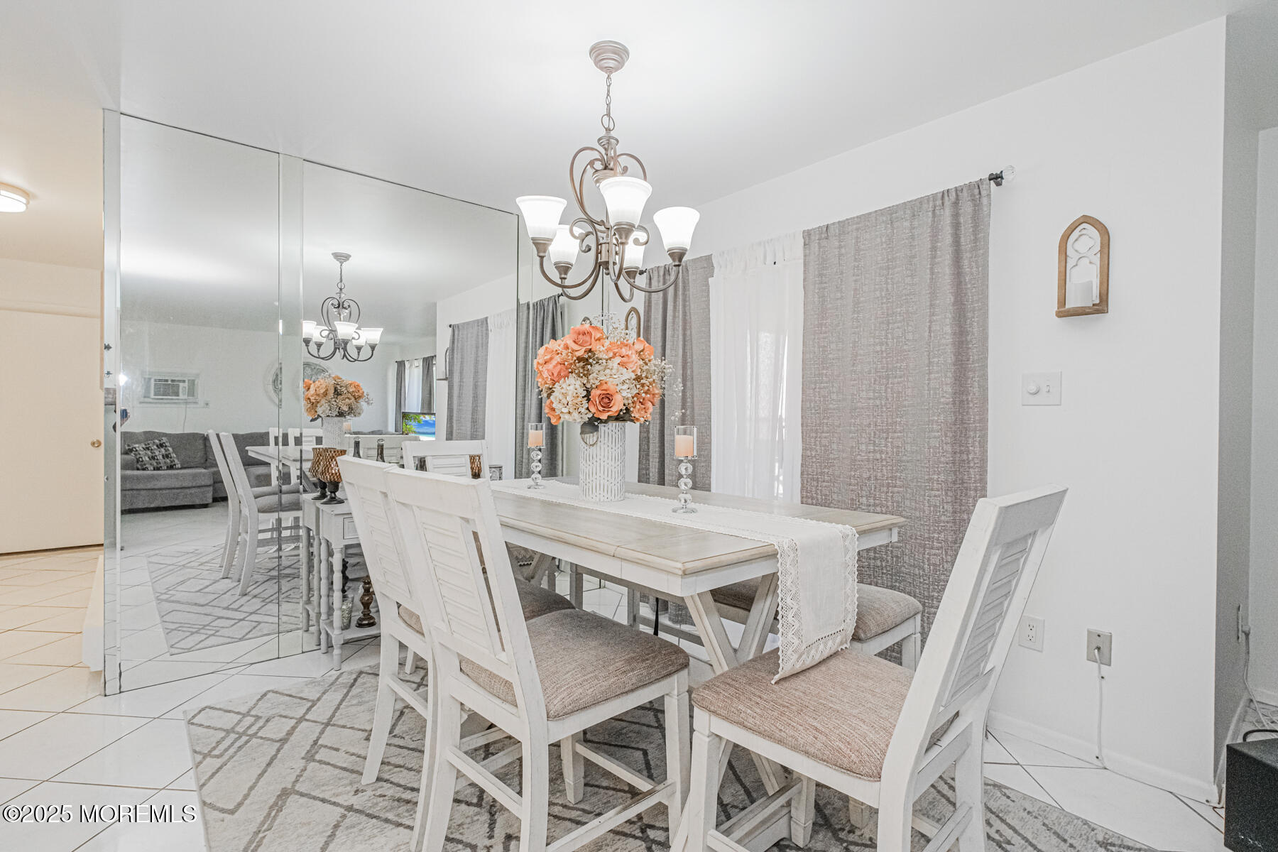 75 Overlook Way, Unit K Manalapan, NJ 07726 - Photo 9 of 24 a view of a dining room with furniture and chandelier