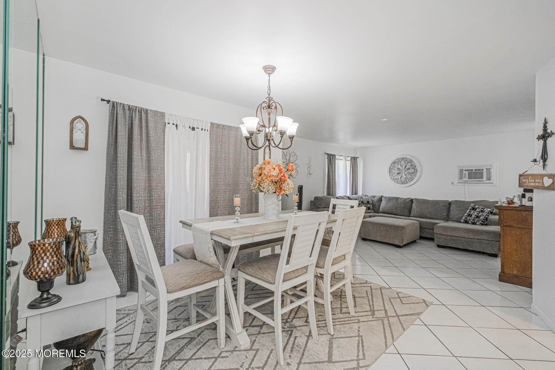 75 Overlook Way, Unit K Manalapan, NJ 07726 - Photo 10 of 24 a living room with furniture a chandelier and a chandelier
