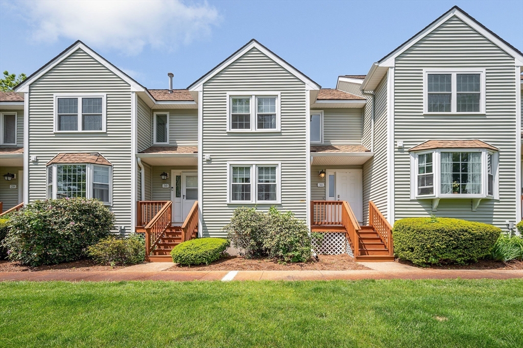 front view of a house next to a yard