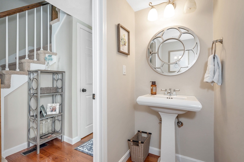 31 Patrick Road, Unit 31 Tewksbury, MA 01876 - Photo 15 of 40 a bathroom with a sink and a mirror