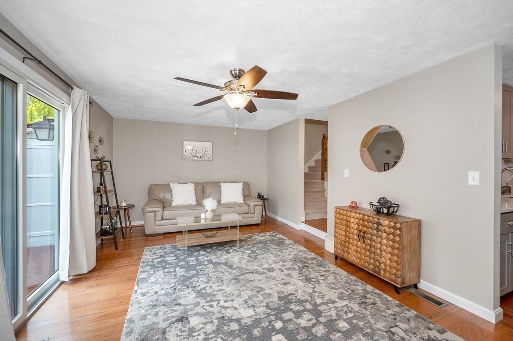 31 Patrick Road, Unit 31 Tewksbury, MA 01876 - Photo 19 of 40 a living room with furniture and a rug