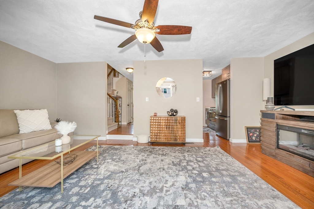 31 Patrick Road, Unit 31 Tewksbury, MA 01876 - Photo 20 of 40 a bedroom with furniture and a flat screen tv