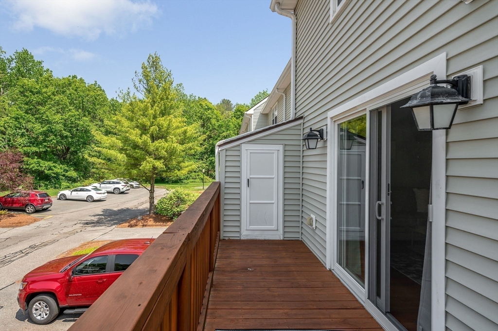 31 Patrick Road, Unit 31 Tewksbury, MA 01876 - Photo 23 of 40 a balcony view with an outdoor space