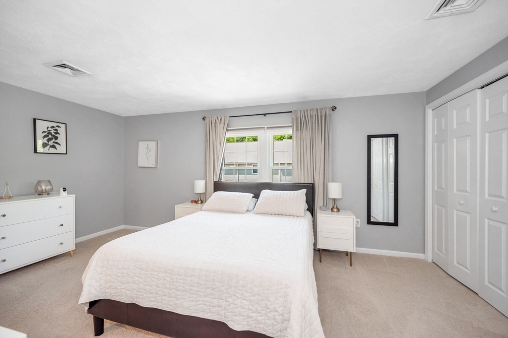 31 Patrick Road, Unit 31 Tewksbury, MA 01876 - Photo 25 of 40 a bedroom with a bed and a window