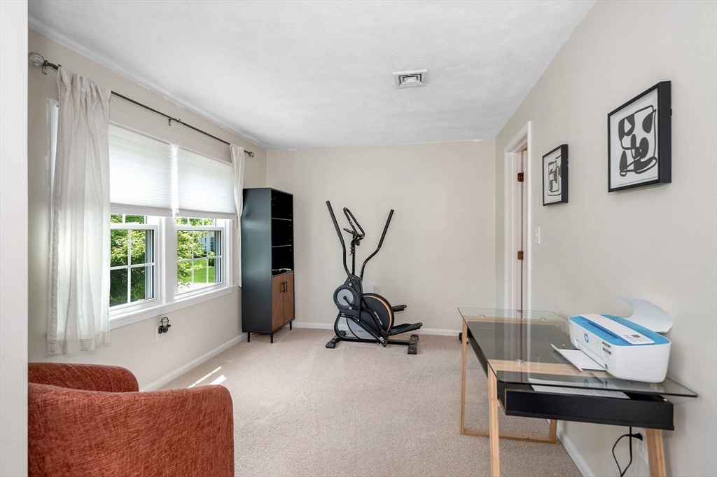 31 Patrick Road, Unit 31 Tewksbury, MA 01876 - Photo 33 of 40 a room with furniture and a window
