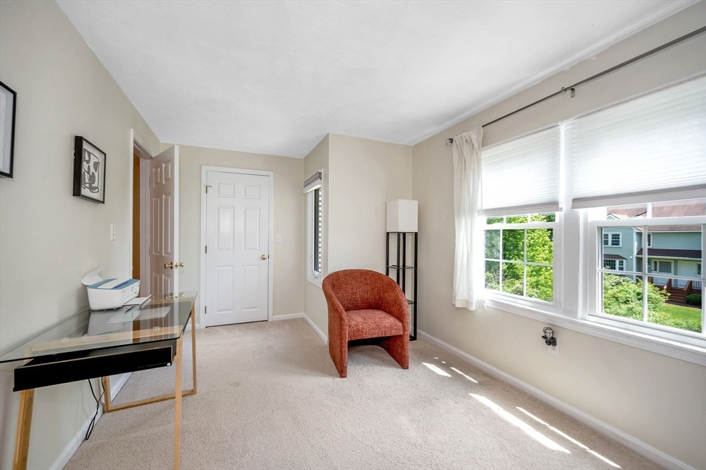 31 Patrick Road, Unit 31 Tewksbury, MA 01876 - Photo 34 of 40 a living room with furniture and a window