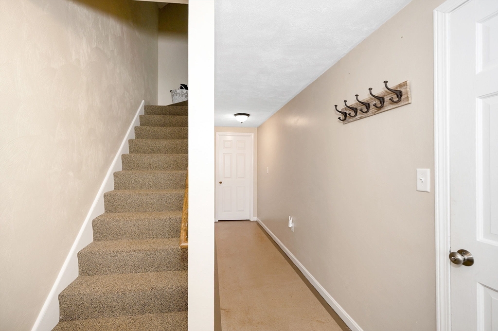 31 Patrick Road, Unit 31 Tewksbury, MA 01876 - Photo 36 of 40 a view of a hallway with staircase
