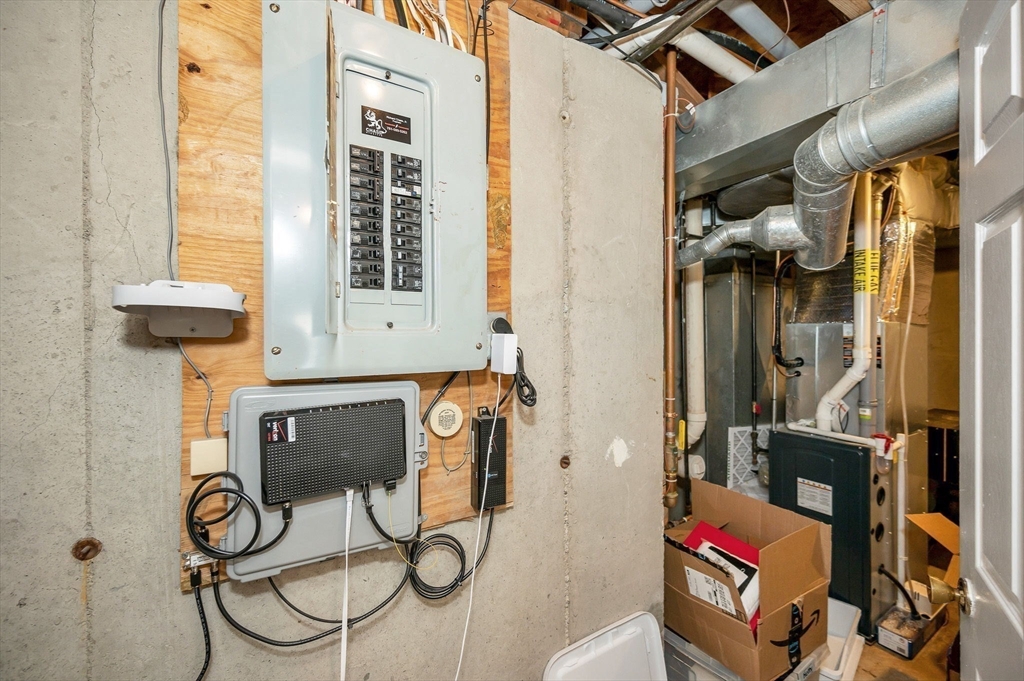 31 Patrick Road, Unit 31 Tewksbury, MA 01876 - Photo 39 of 40 a view of storage and utility room