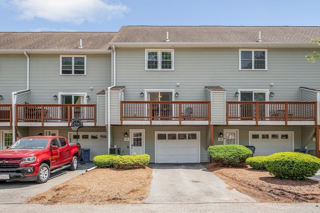 31 Patrick Road, Unit 31 Tewksbury, MA 01876 - Photo 40 of 40 a car parked in front of a building