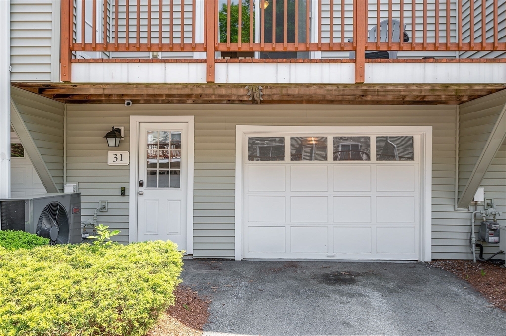 31 Patrick Road, Unit 31 Tewksbury, MA 01876 - Photo 4 of 40 a view of a house with a backyard