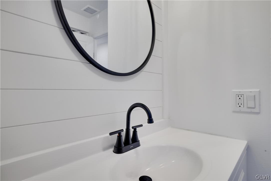 107 Barrys Road Effort, PA 18330 - Photo 24 of 32 a bathroom with a sink and a mirror