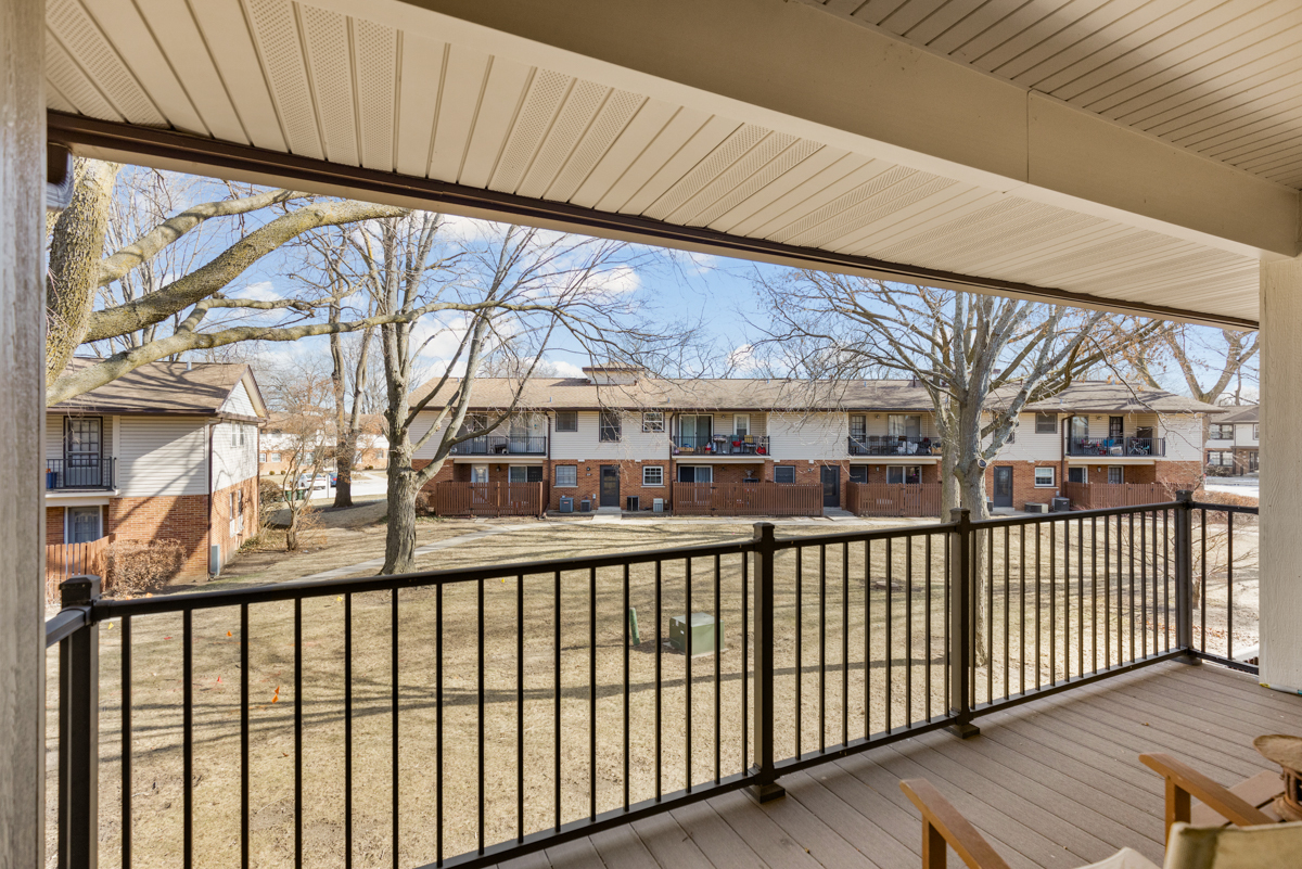 217 Washington Square, Unit D Elk Grove Village, IL 60007 - Photo 12 of 14 a view of a large building from a balcony