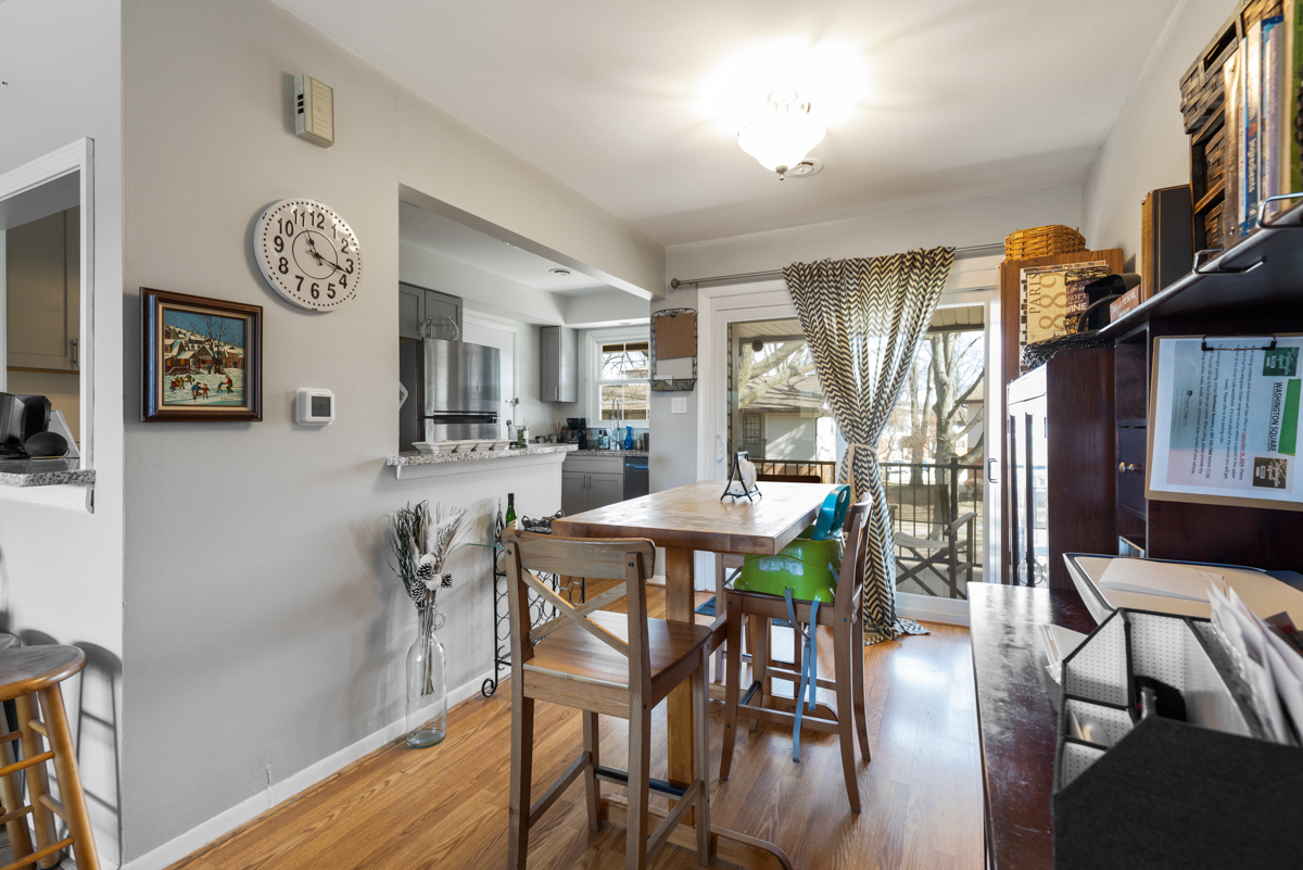 217 Washington Square, Unit D Elk Grove Village, IL 60007 - Photo 8 of 14 a view of a dining room with furniture and wooden floor