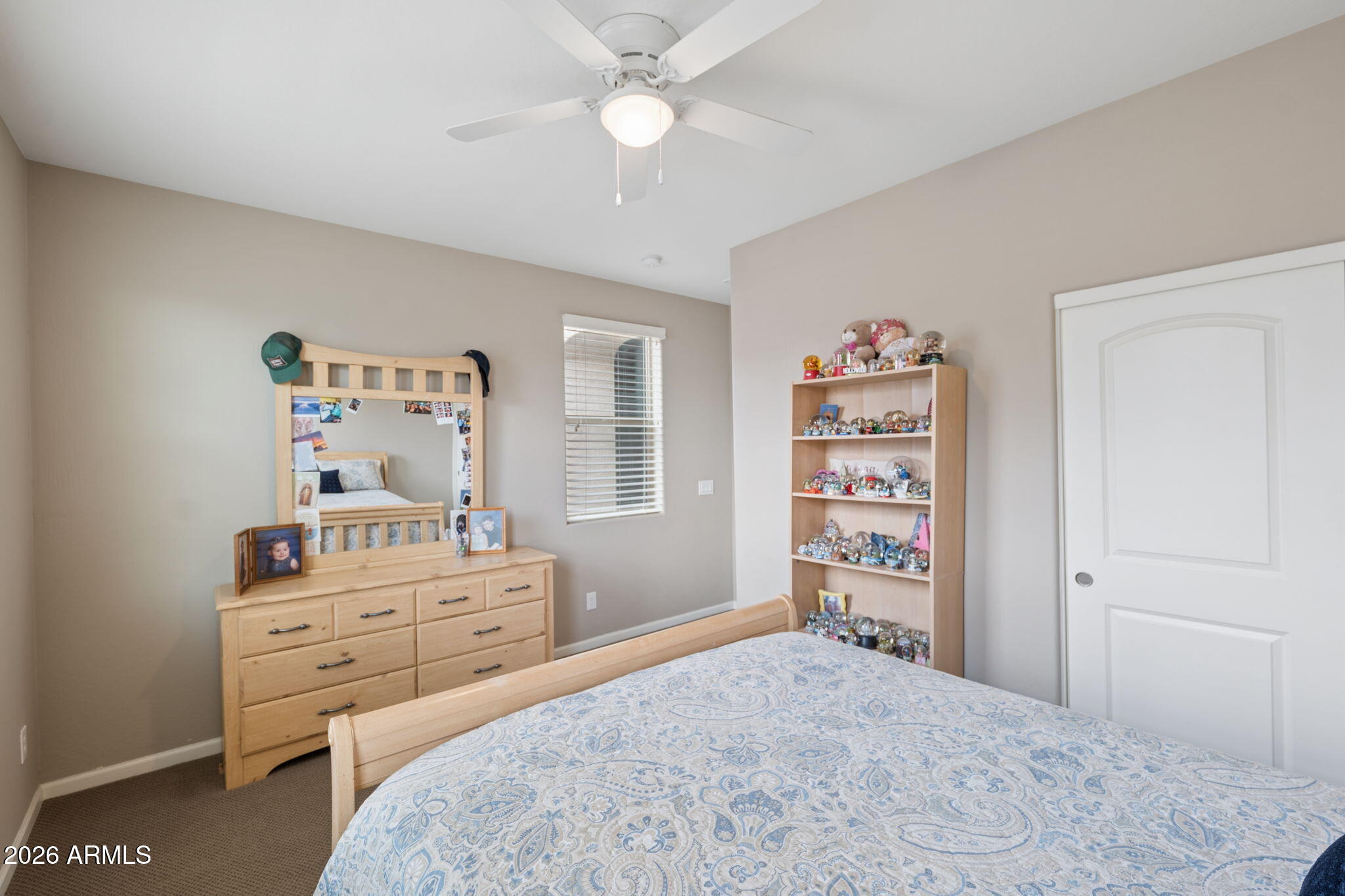 8993 West Ruth Avenue Peoria, AZ 85345 - Photo 14 of 24 a bedroom with a bed and a television