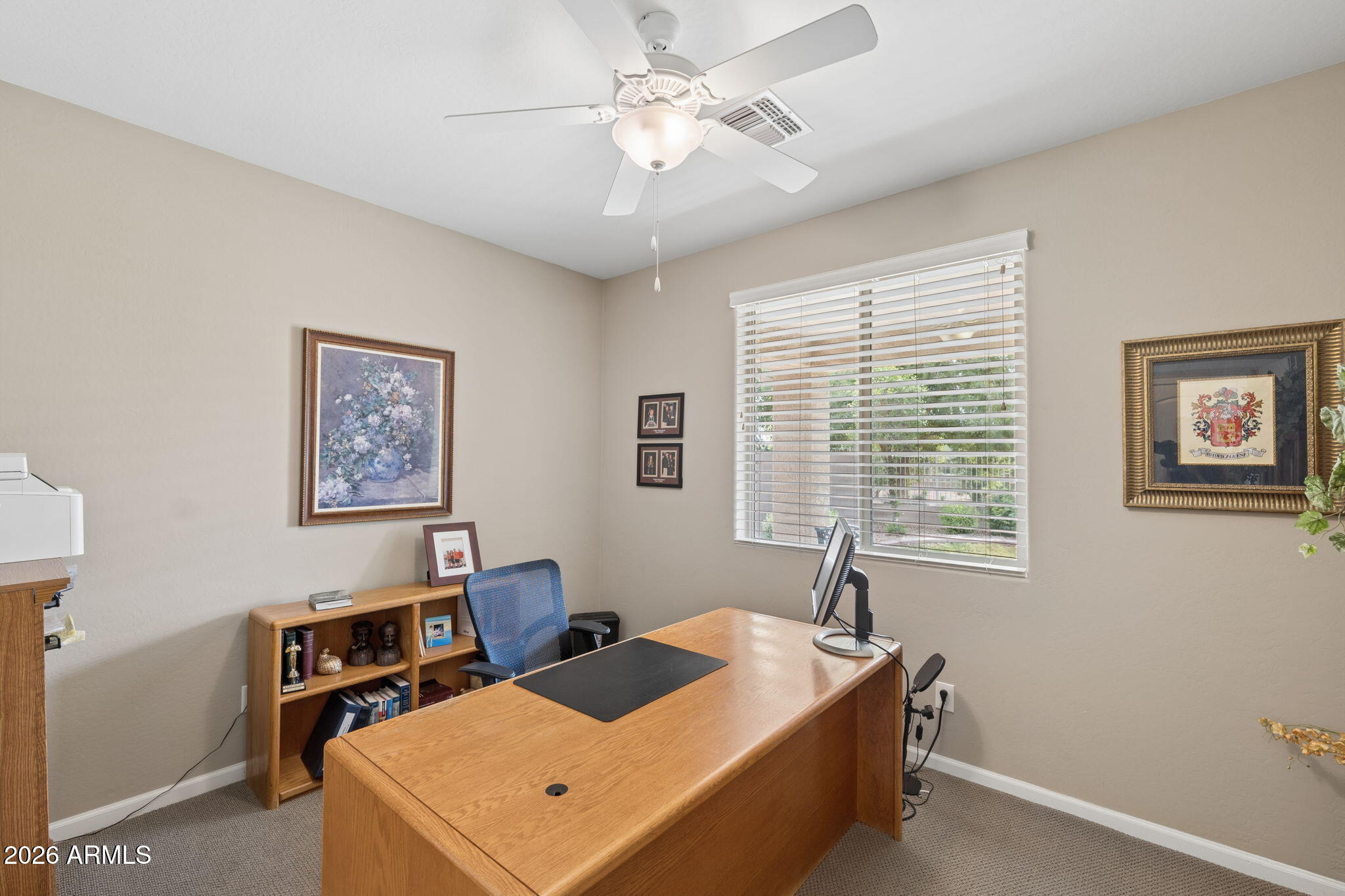 8993 West Ruth Avenue Peoria, AZ 85345 - Photo 18 of 24 a bed room with a bed and a window