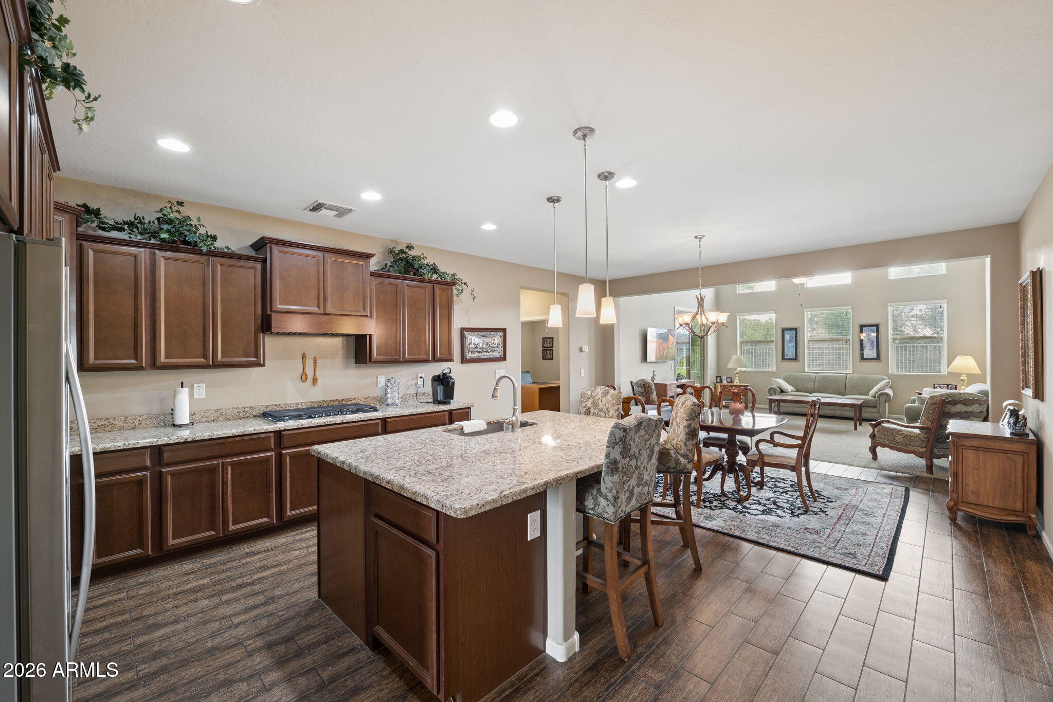 8993 West Ruth Avenue Peoria, AZ 85345 - Photo 2 of 24 a kitchen with lots of counter top space and living room