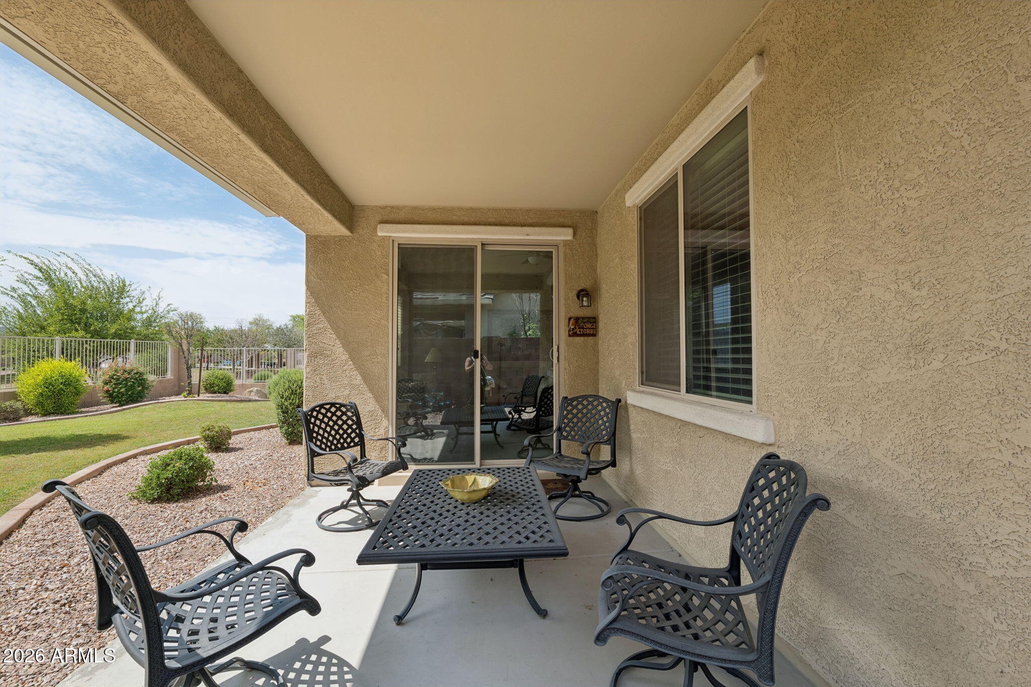 8993 West Ruth Avenue Peoria, AZ 85345 - Photo 21 of 24 a view of a patio with couches chairs and a table