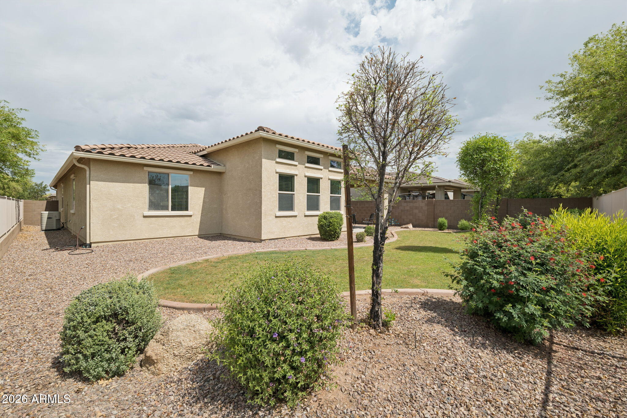 8993 West Ruth Avenue Peoria, AZ 85345 - Photo 24 of 24 a front view of a house with garden