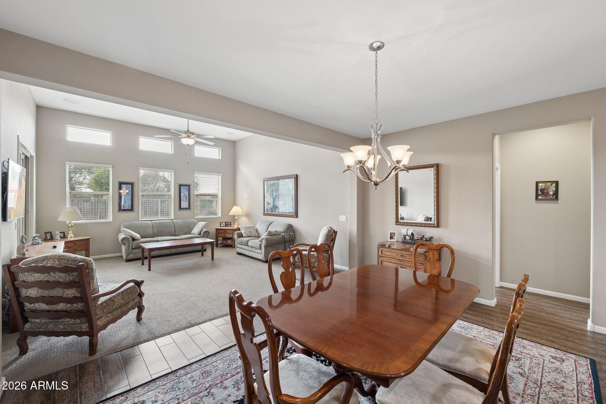 8993 West Ruth Avenue Peoria, AZ 85345 - Photo 5 of 24 a view of a dining room with furniture window and wooden floor