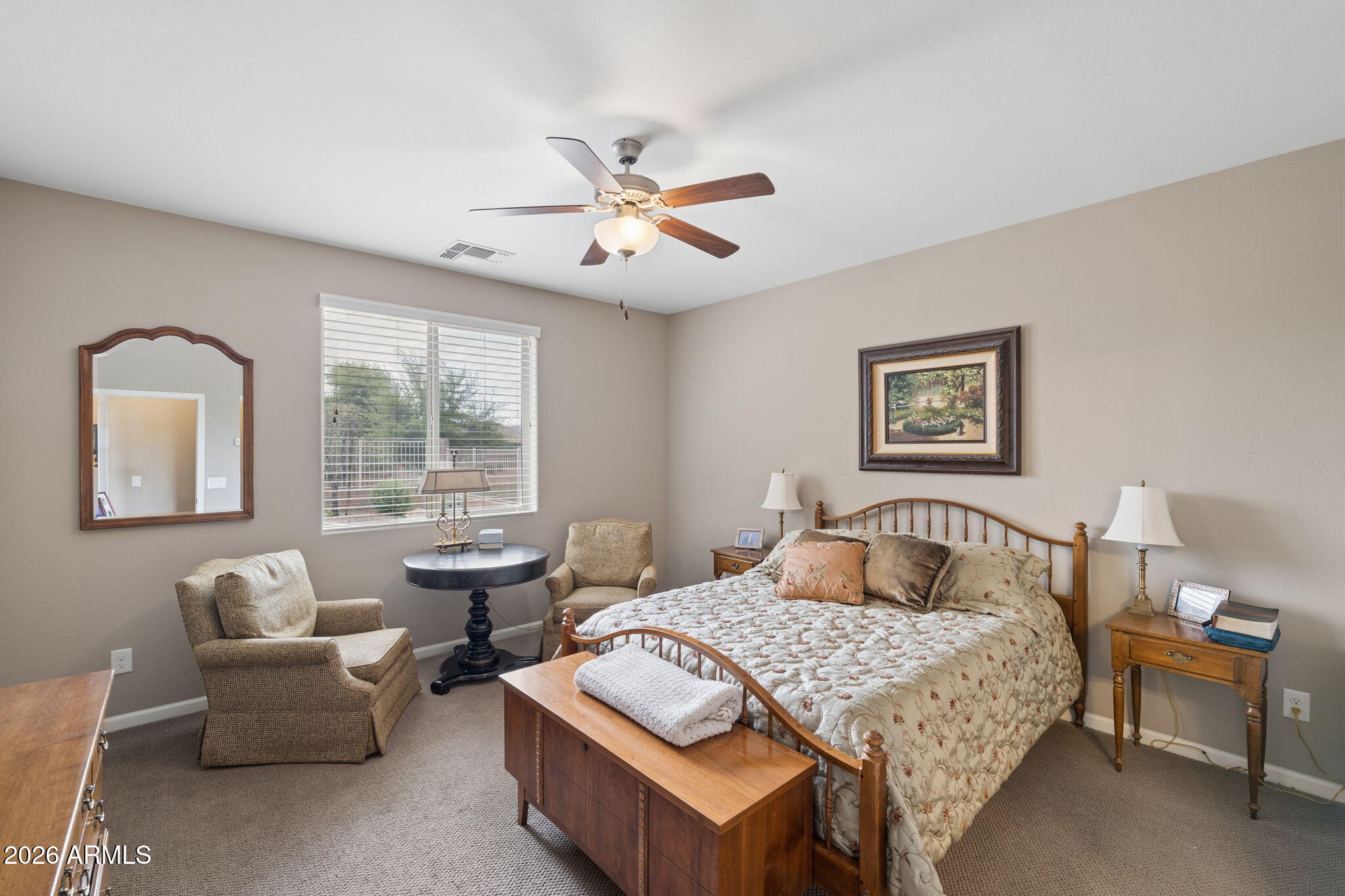 8993 West Ruth Avenue Peoria, AZ 85345 - Photo 9 of 24 a bedroom with a bed and a couch