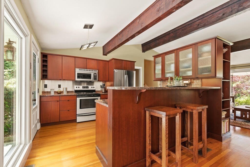 19 West Chardon Road Winchester, MA 01890 - Photo 11 of 40 a kitchen with stainless steel appliances granite countertop a refrigerator a stove top oven a sink and dishwasher