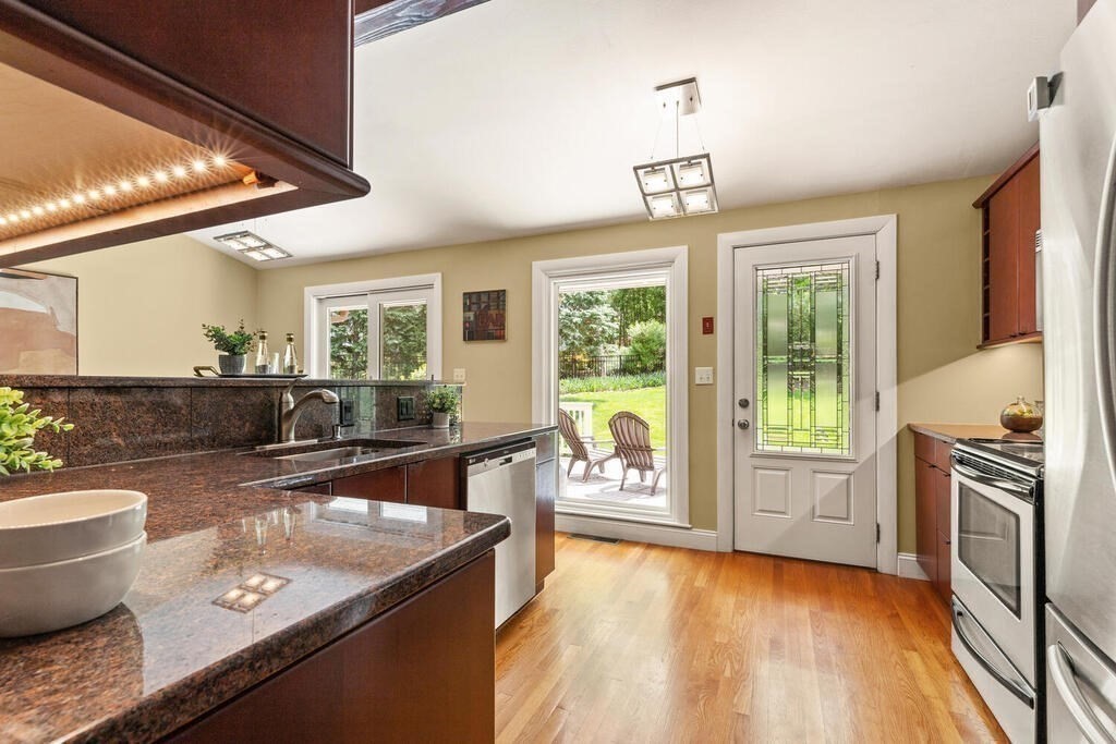 19 West Chardon Road Winchester, MA 01890 - Photo 12 of 40 a view of a kitchen with granite countertop a large window and a counter space