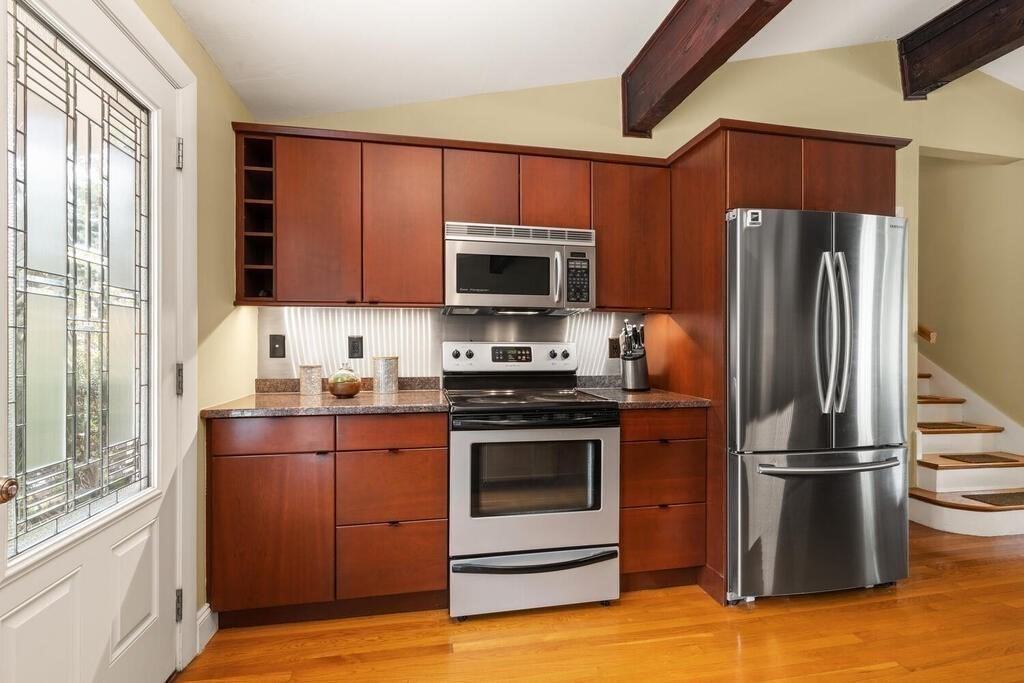 19 West Chardon Road Winchester, MA 01890 - Photo 13 of 40 a kitchen with a refrigerator stove and microwave