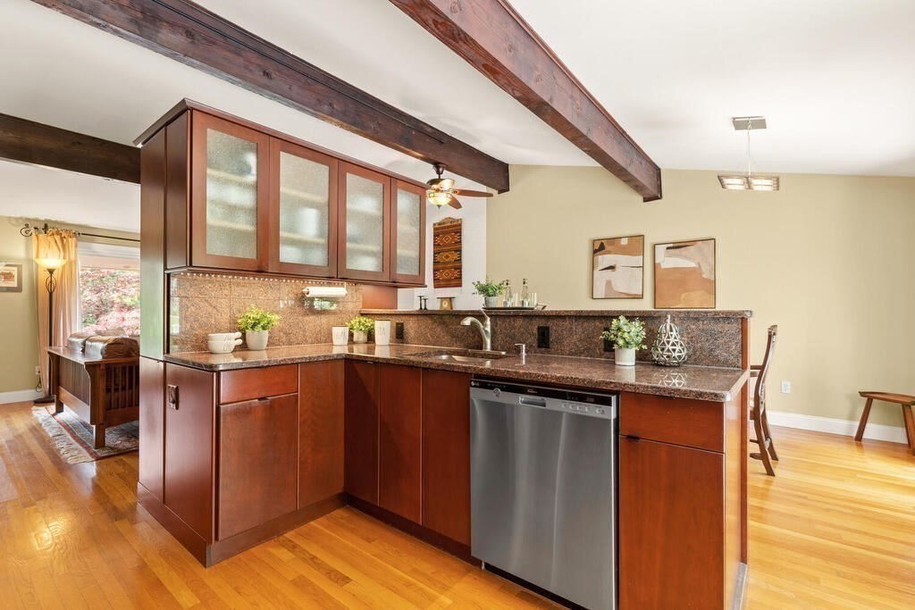 19 West Chardon Road Winchester, MA 01890 - Photo 14 of 40 a kitchen with stainless steel appliances granite countertop a stove and cabinets